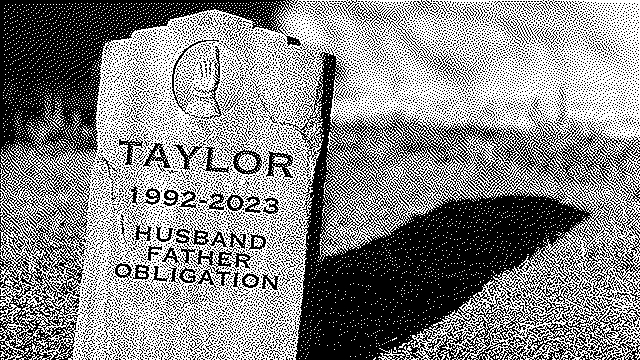 gravestone inscribed "taylor, 1992-2023, husband, father, obligation"